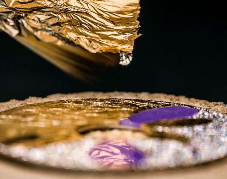 Laying of the gold leaf on the dial