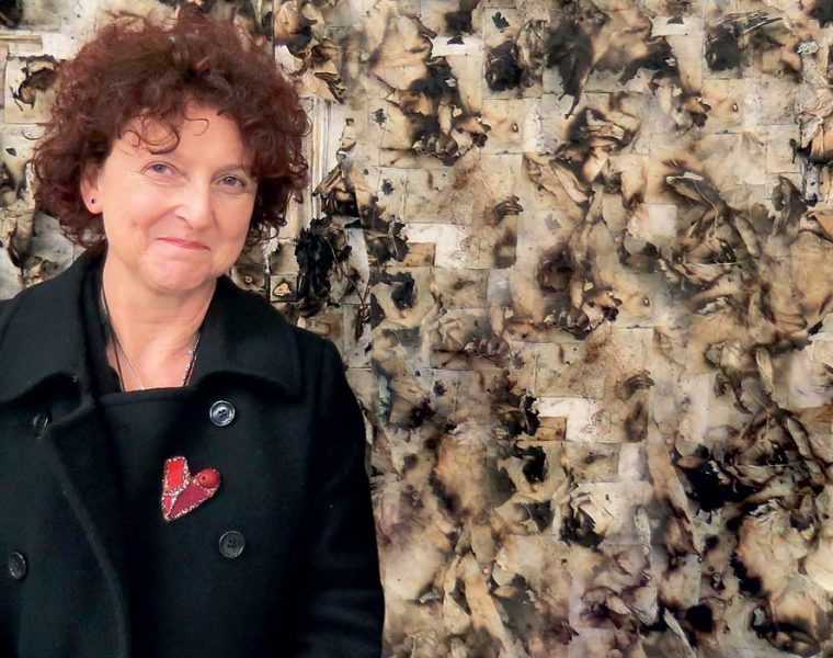 Portrait of Venetia Porter.Photo Hanaa Malallah with her work in the background. Triangle Gallery,London,February 2013