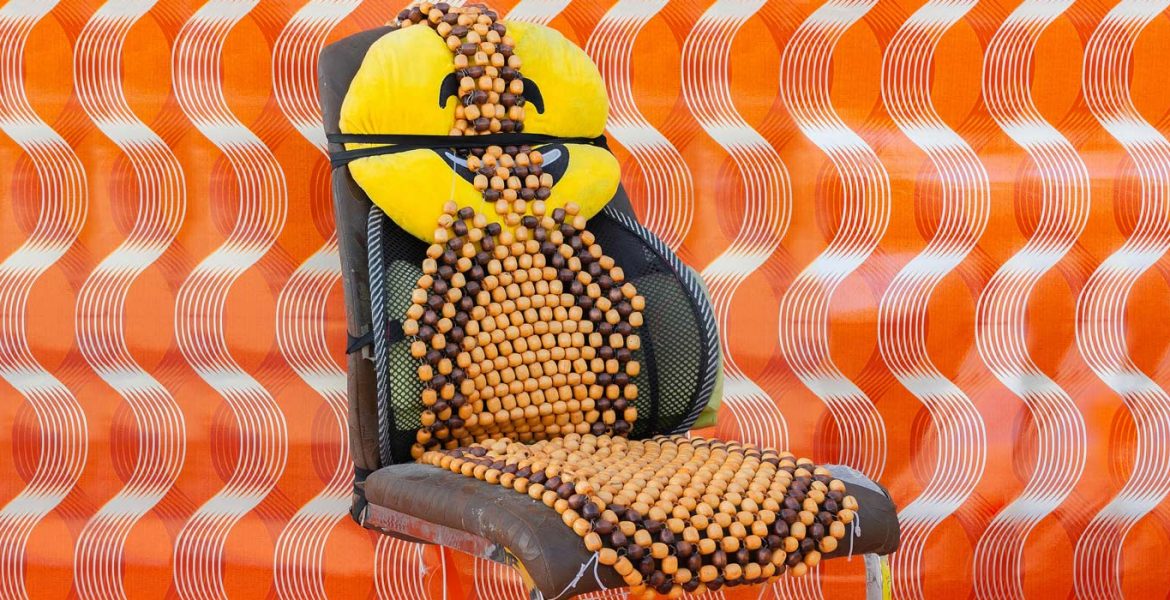 Dining chair with car seat beads and emoji pillow