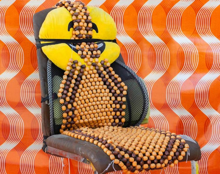 Dining chair with car seat beads and emoji pillow