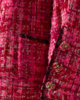 Chanel (couture house), Gabrielle Chanel (designer). Suit comprising jacket, skirt and blouse spring–summer 1966. (detail). Overpainted wool, raw silk, gilt-gold metal National Gallery of Victoria, Melbourne. Presented through The Art Foundation of Victoria by Mrs Angela Wood, Member, 2000. Photo: Narelle Wilson, NGV